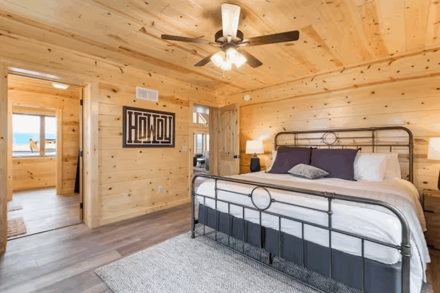large master bedroom and bathroom with ceiling fan in Driggs ID Canyon lodge modular log cabin