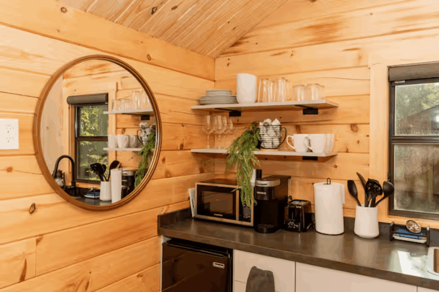 kitchen area of log studio park model tiny home in James Creek Pa studio 2