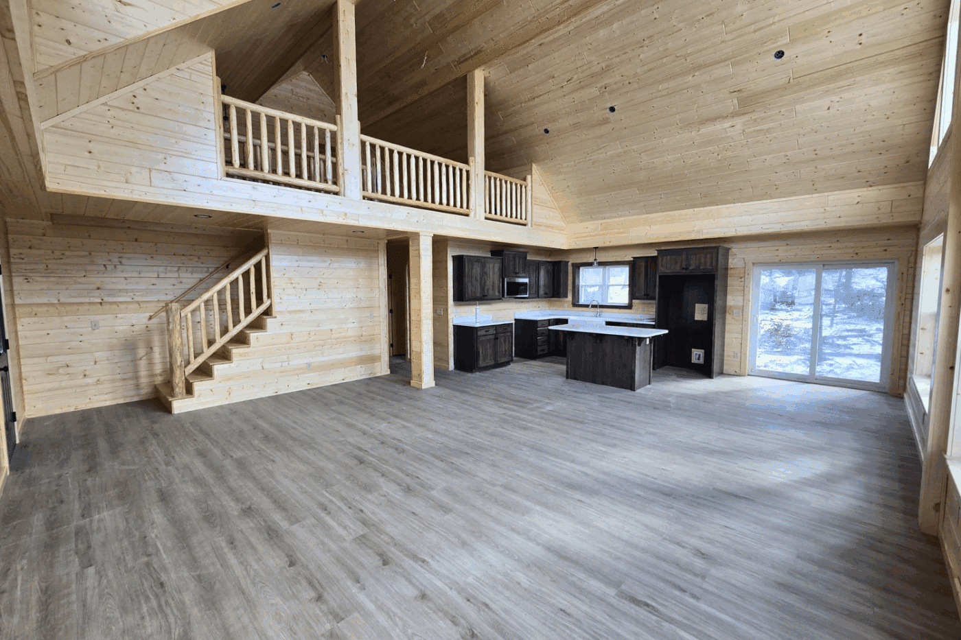 30x48 Glacier Log Cabin living room kitchen and loft space in Holloway Angel Fire NM built and designed by Psy Homes