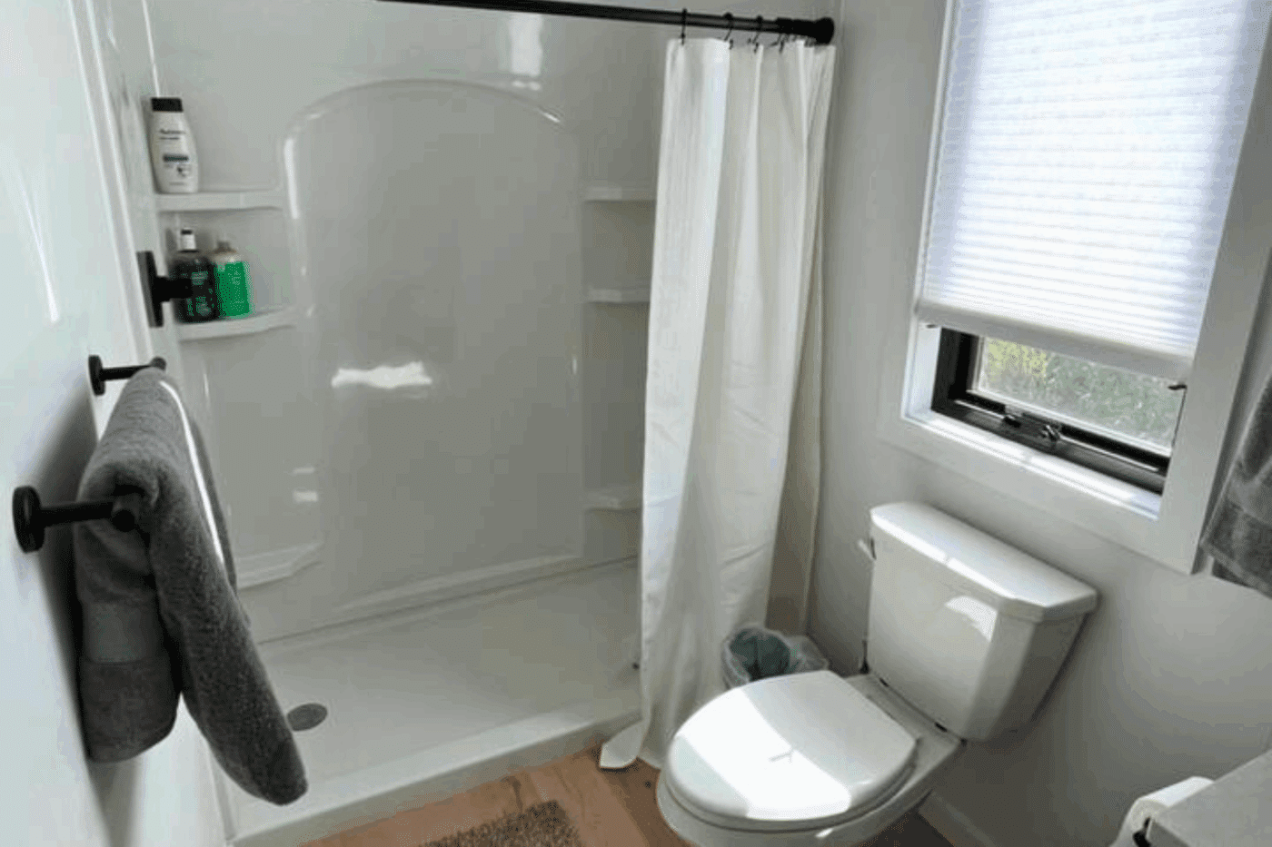 Large walk in shower of A frame park model tiny home built by Zook cabins in Durango Co