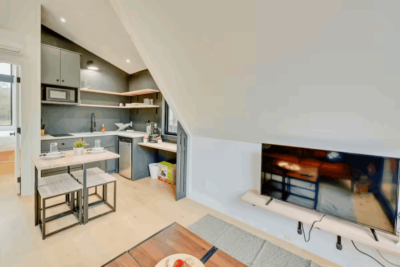 living room and dining room of A Frame park model tiny home Trout in Broken Bow OK