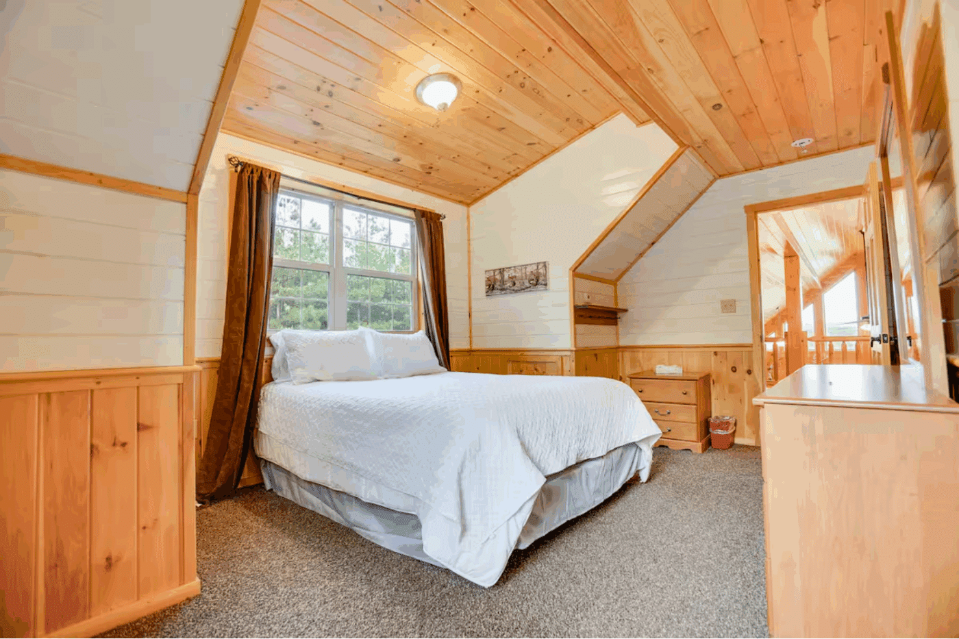 bedroom 5 in customer finished loft of mountaineer deluxe log cabin built and designed by Psy Homes