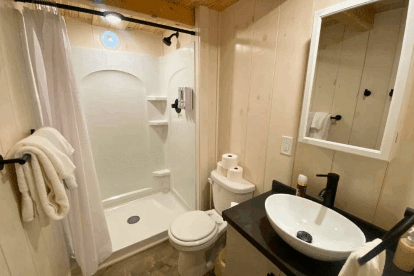 full sized bathroom in Aspen 3 park model log tiny home in Michigan UP at Keweenaw Water Resort