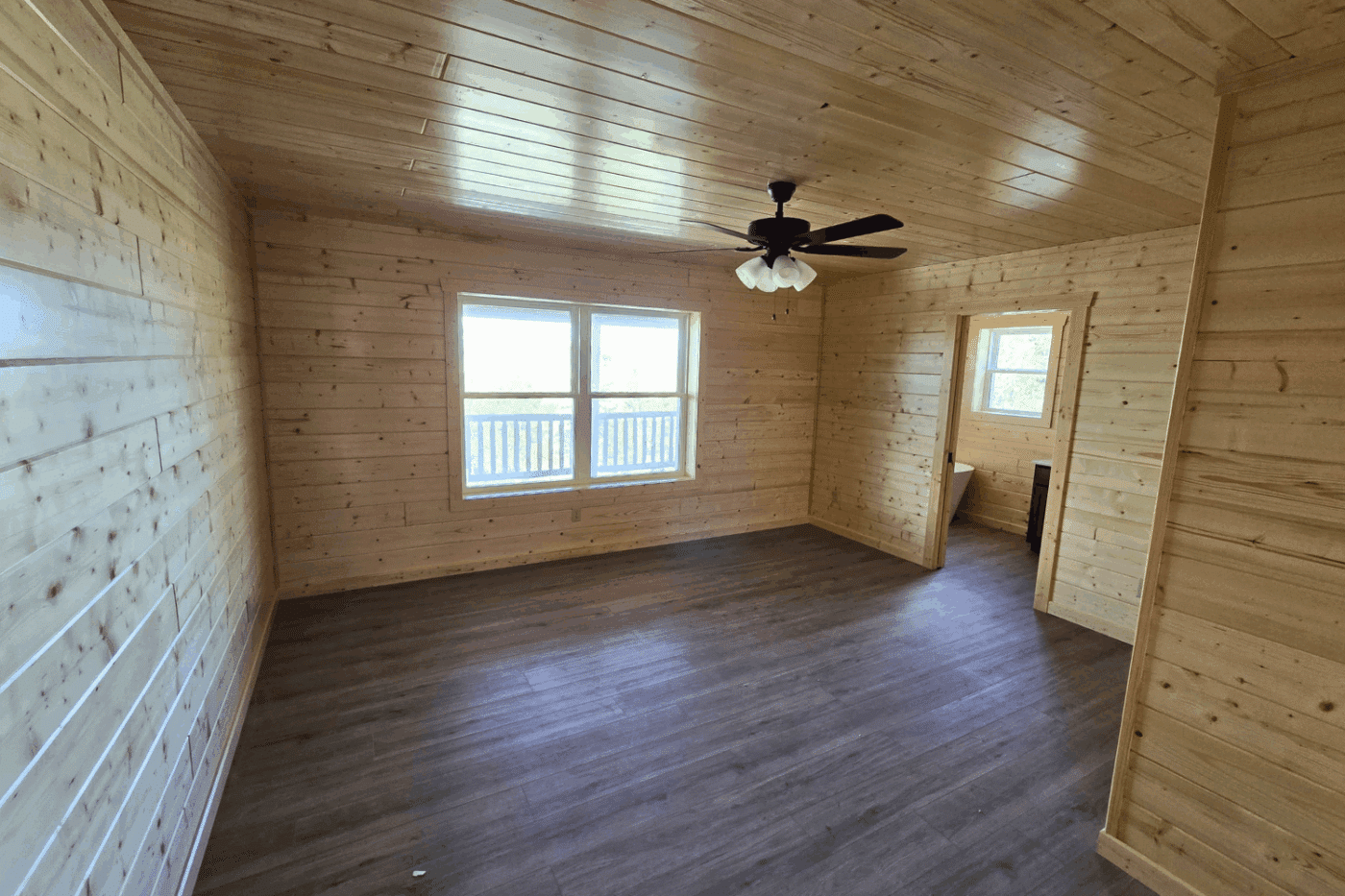 bedroom with full bathroom and soaking tub in 30x48 Glacier Holloway Angel Fire NM built and designed by Psy Homes