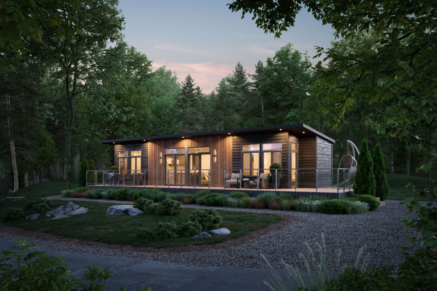 Modern Sonoma park model tiny home surrounded by trees at dusk, with large windows glowing warmly.