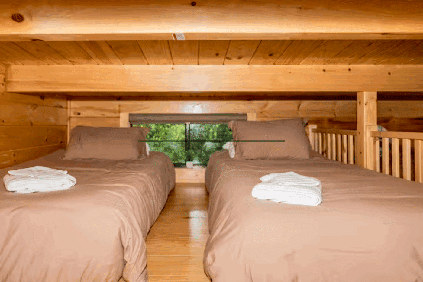 lofted sleeping area of Pinecrest park model tiny home in James Creek Pa