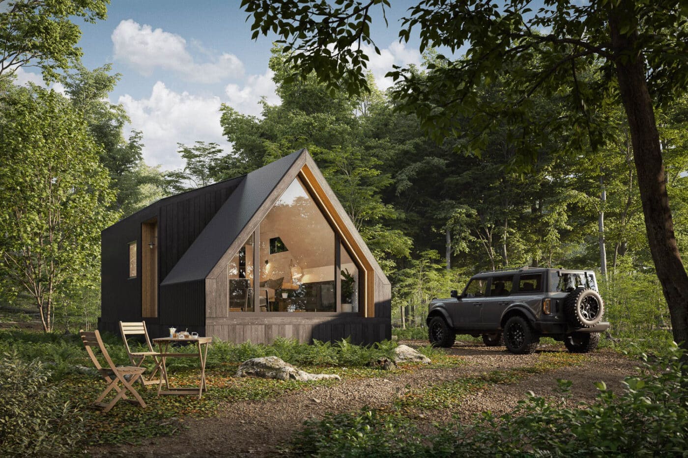 A-frame style park model tiny home with large front windows, parked SUV nearby in a wooded clearing.
