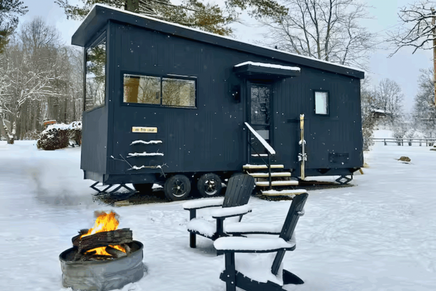 Exterior of Nook Studio Park Model tiny home in winter located in Friedens Pa