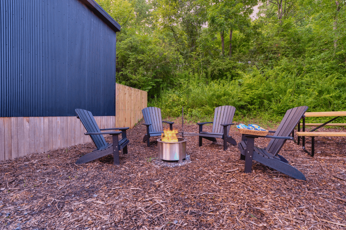 outdoor campfire area of Cascade park model tiny home built by Zook Built and designed by Psy Homes