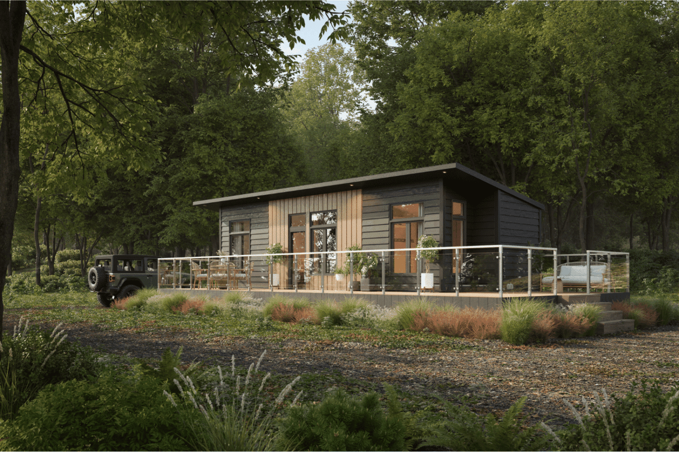 Sonoma park model tiny home with large deck and modern design, surrounded by trees in Michigan.
