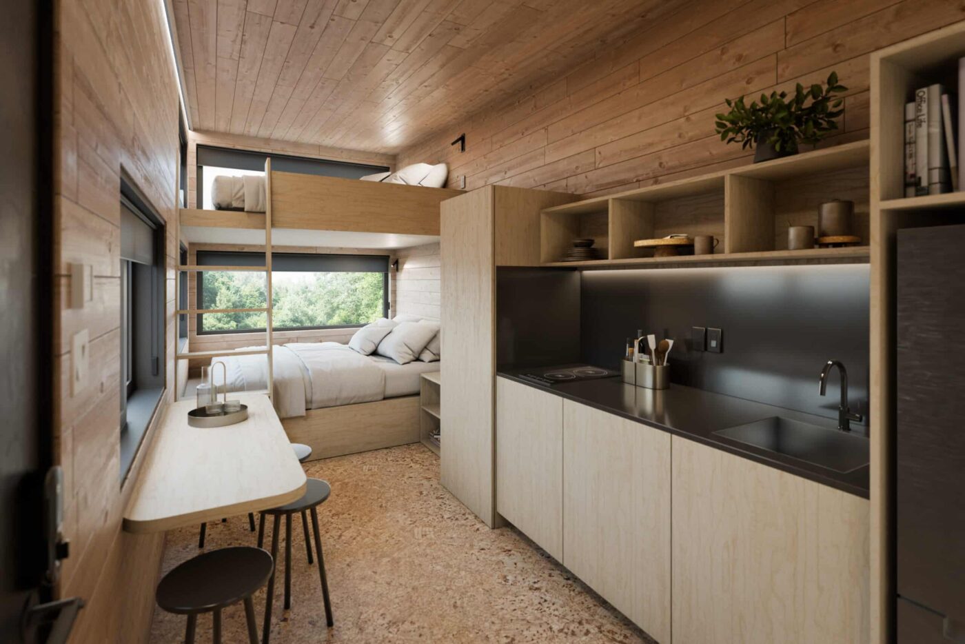Compact kitchen with dining counter and bunk-style sleeping area inside the Nook Family park model.