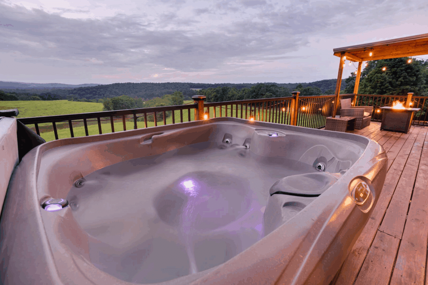 Hot Tub on front porch of Pinecrest park model tiny home in Warfordsburg Pa built and designed by Psy Homes