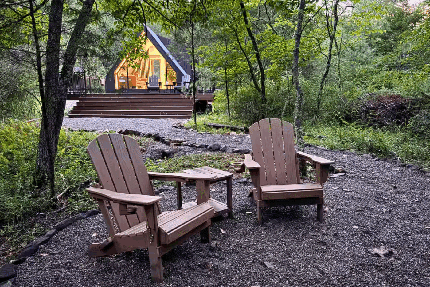 creekside outdoor hospitality area of A frame park model tiny home in Wardensville Pa built and designed by Psy Homes