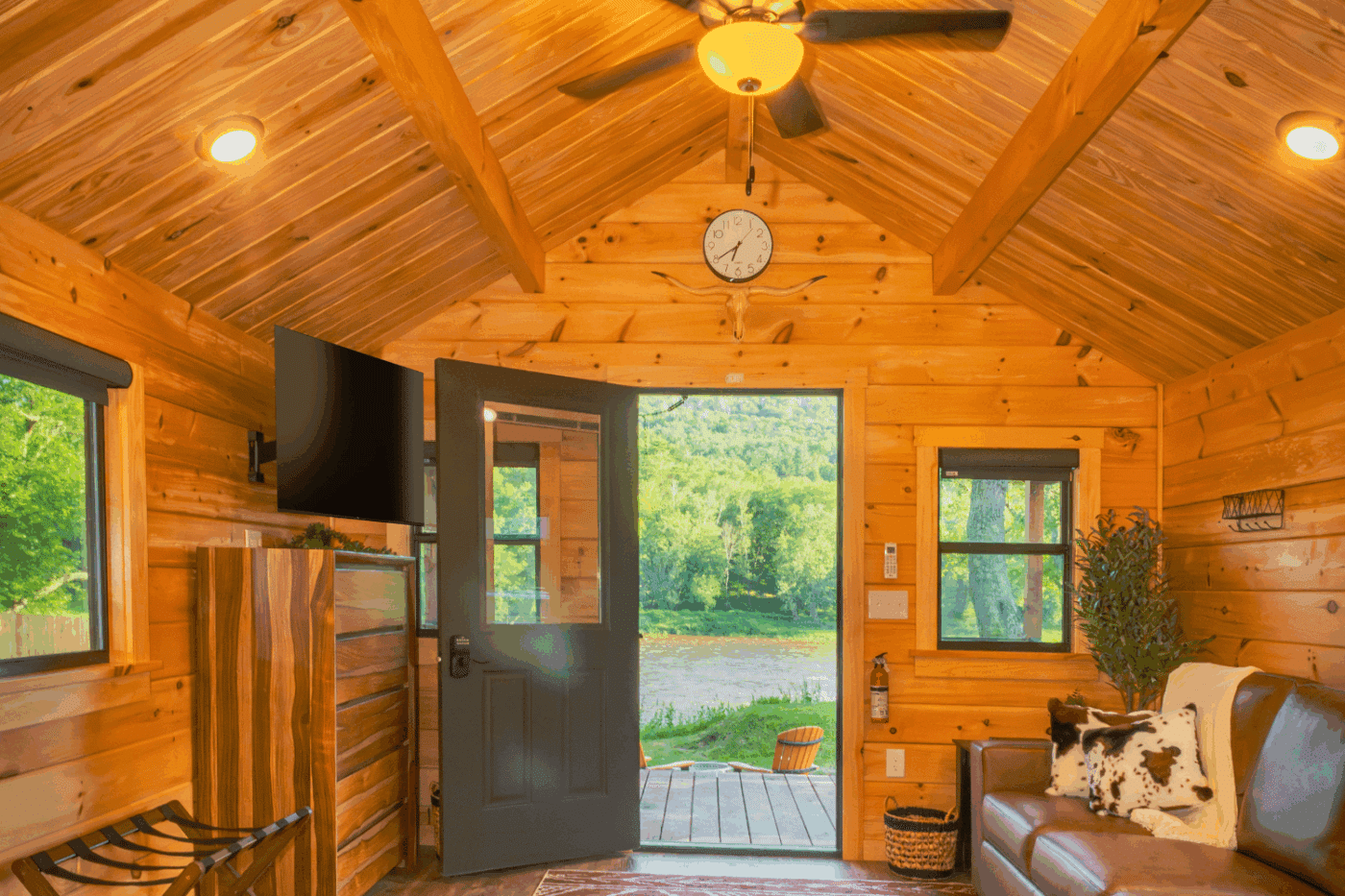 living room of studio log cabin park model tiny home at The outpost in pond eddy new york cabin 3