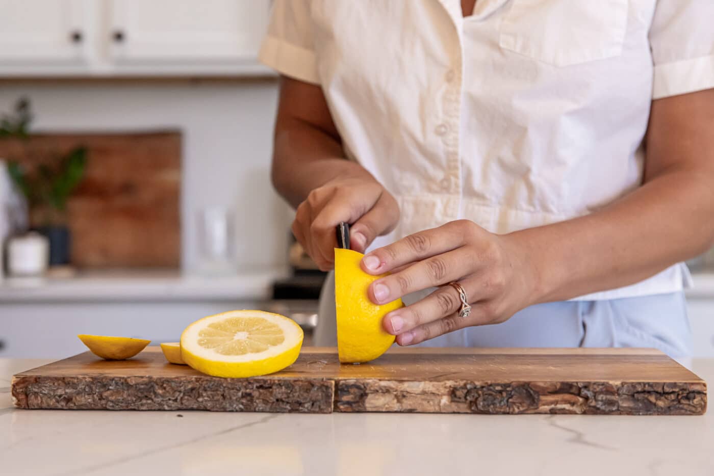 lanie slicing lemons in her homestead modern farmhouse kitchen