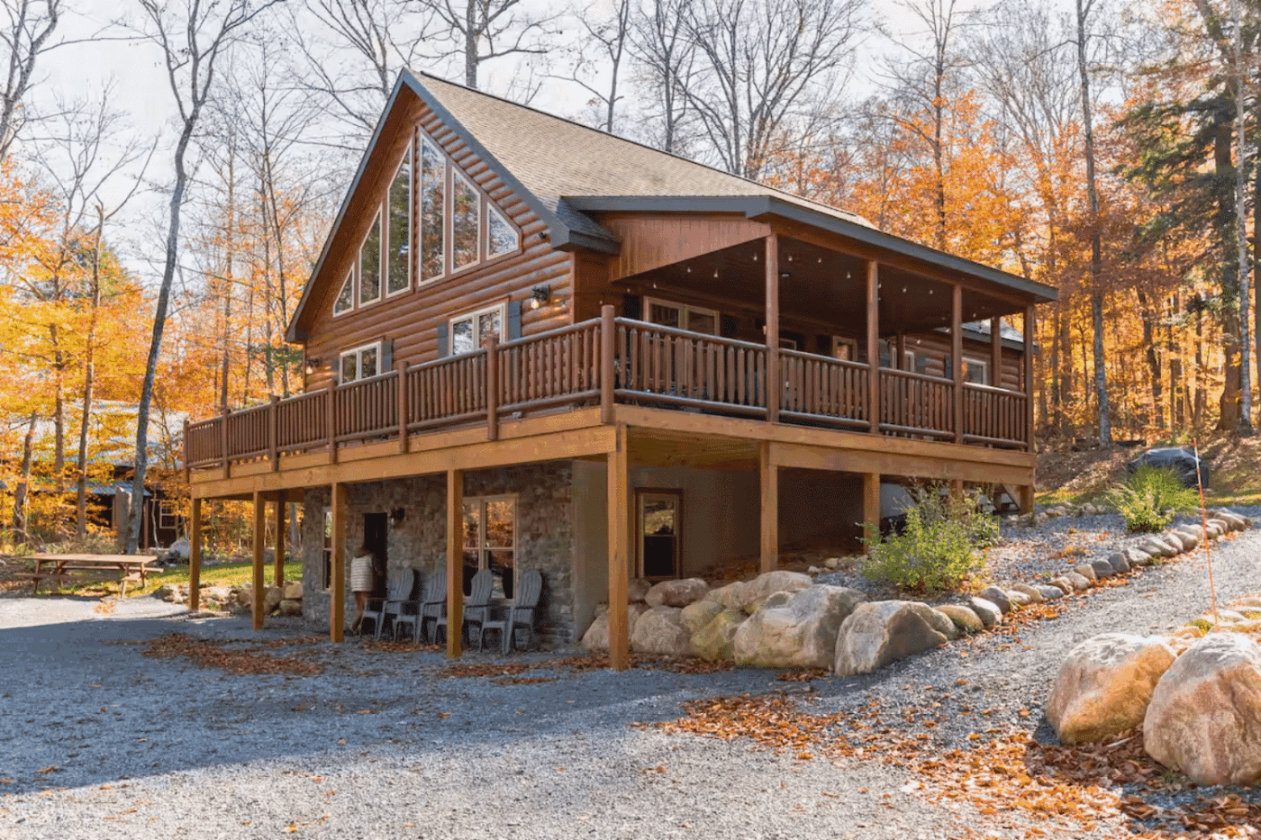 Mountaineer Deluxe log cabin surrounded by autumn colors in New Hampshire.