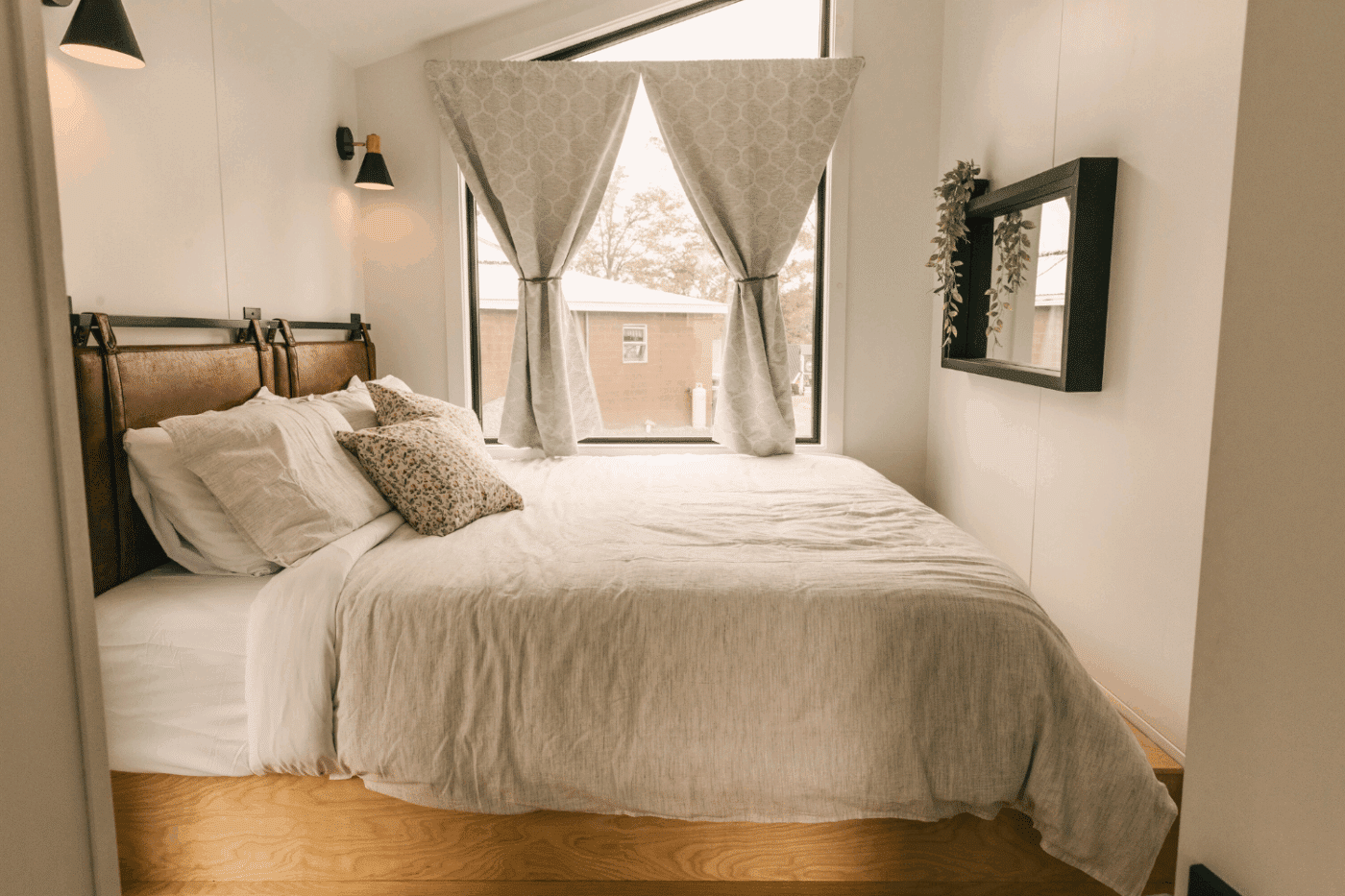bedroom of a frame park model tiny home in friedens pa at somerset resort site 11