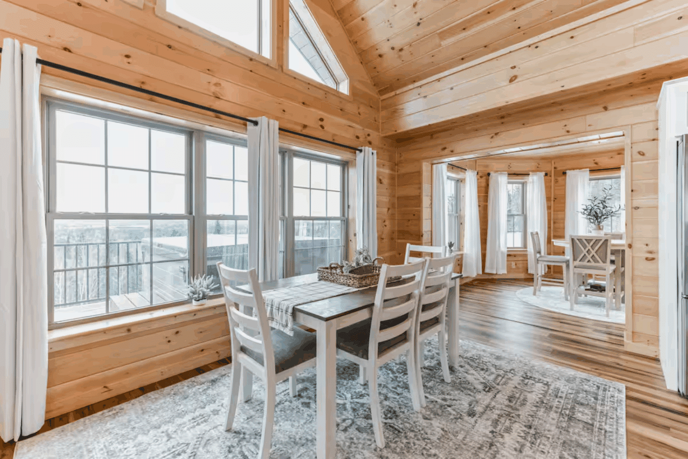 dining area of Moutnaineer Deluxe log modular home in Sarnac Lake NY