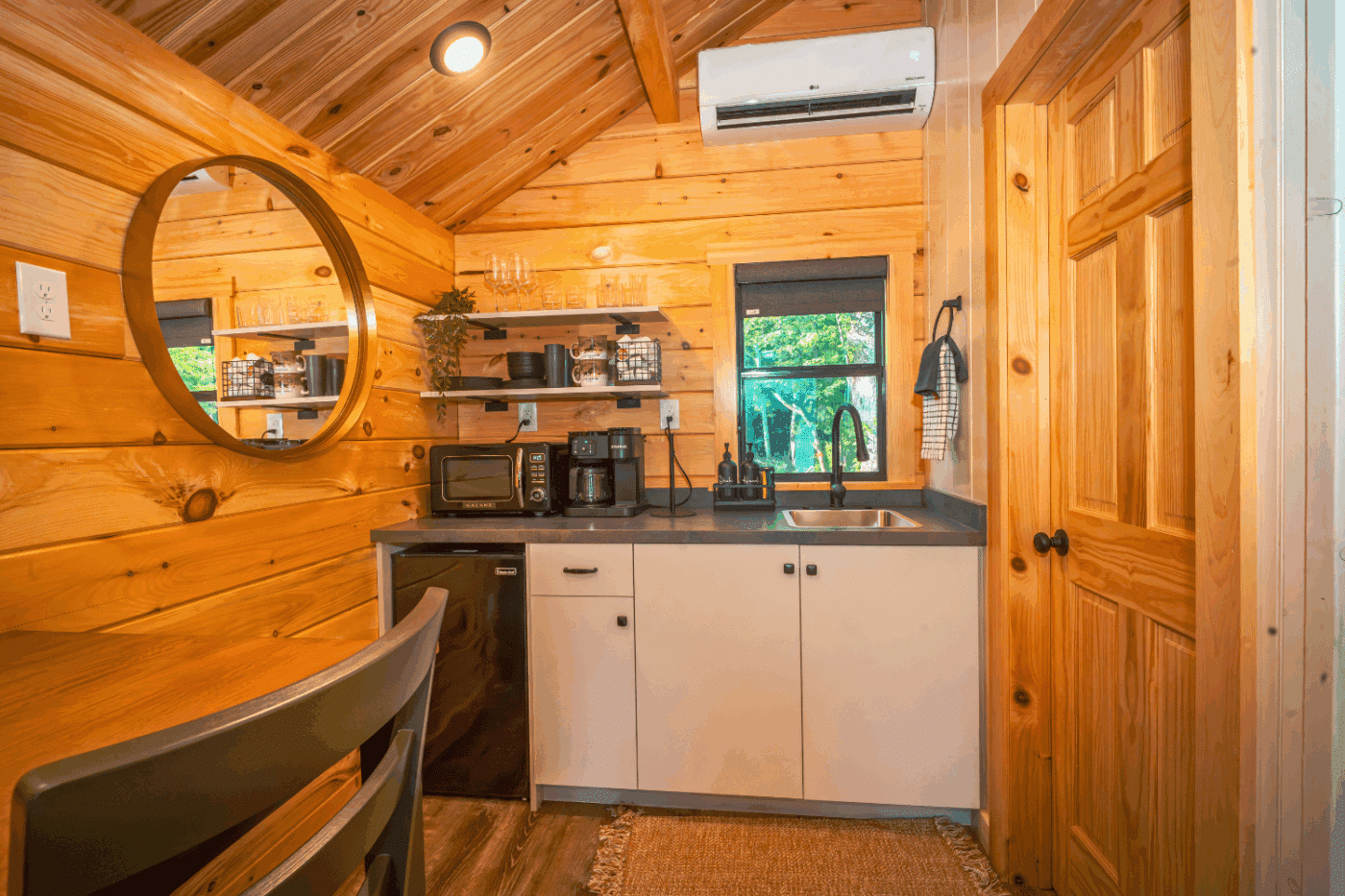 kitchen of log studio park model tiny home in pond eddy new york at the outpost cabin 4