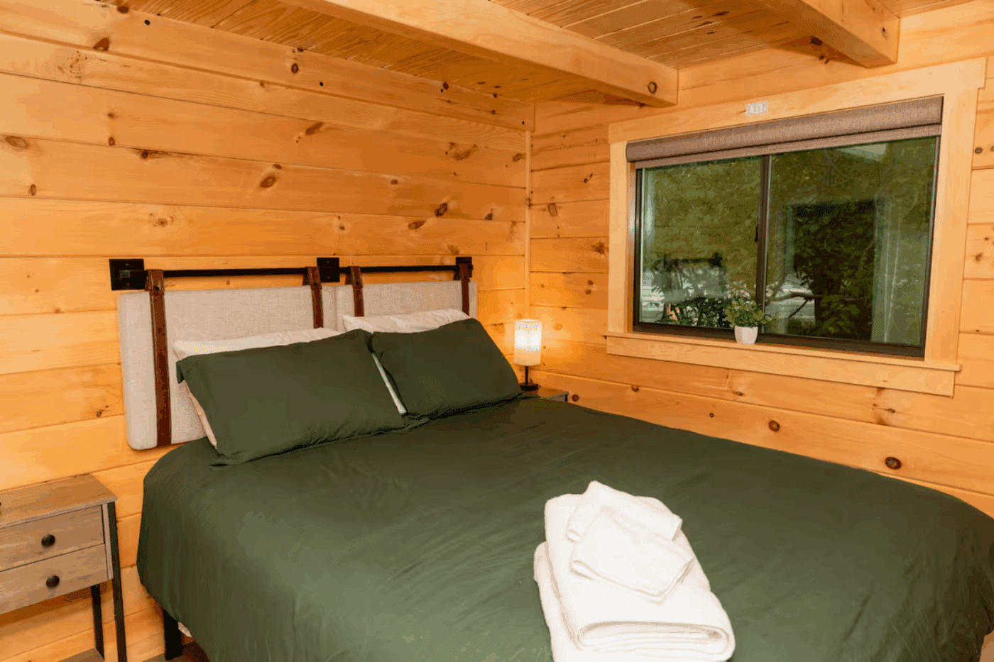 Pinecrest park model tiny home main bedroom in James Creek Pa