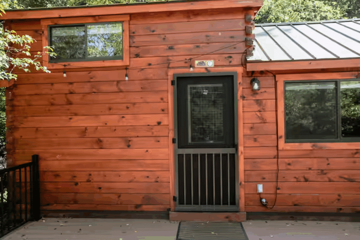 Entry way of Pinecrest park model log tiny home in James Creek Pa