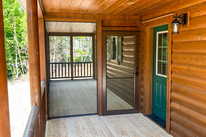 porch on log home in campton nh