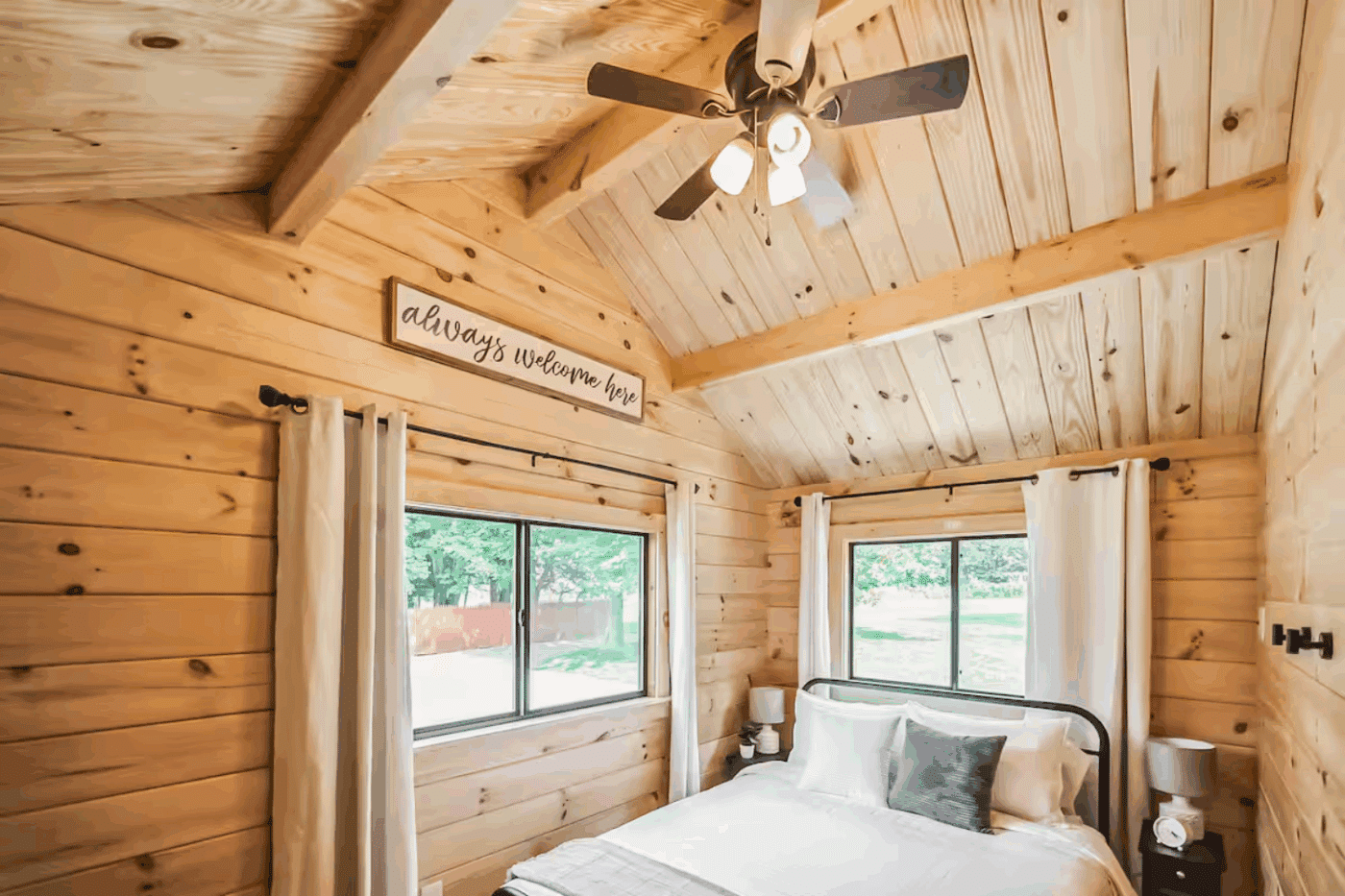 Primary bedroom of Pinecrest park model tiny home with cathedral ceiling located in Strasburg Pa built and designed by Psy Homes
