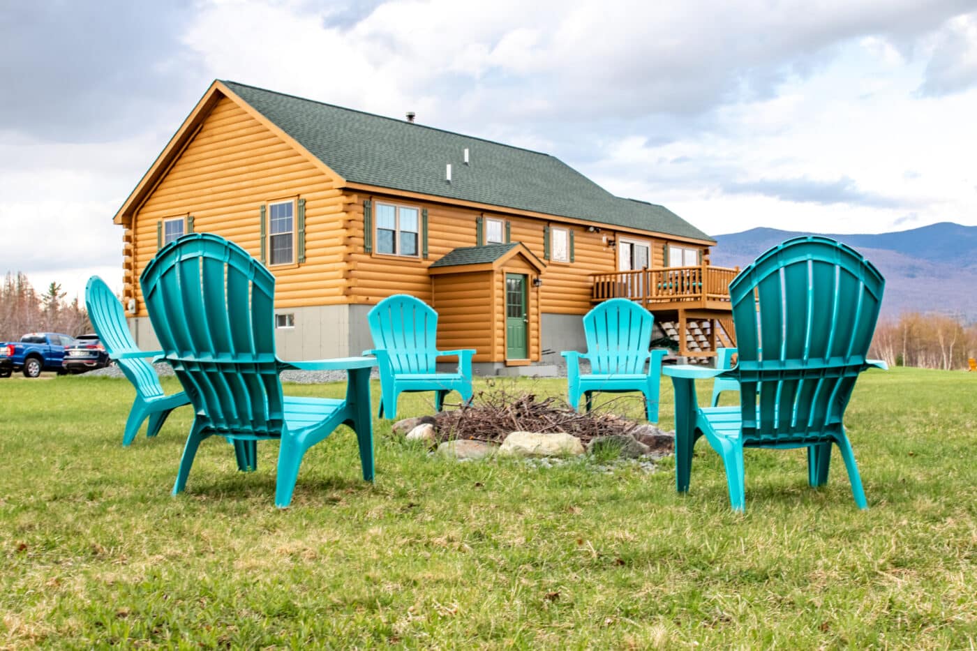 fire pit next to musketeer log cabin