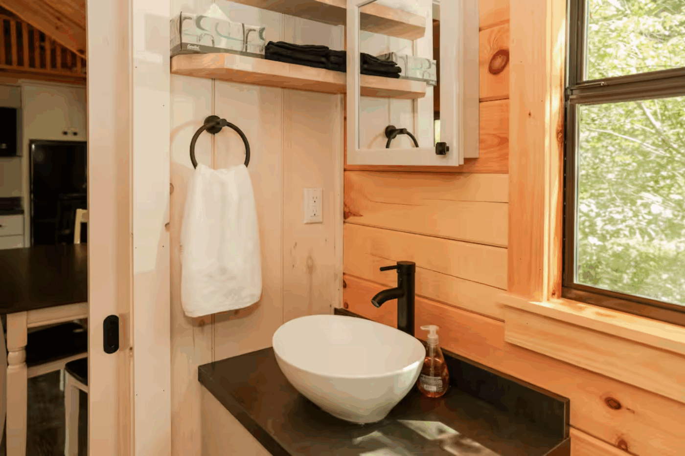 bathroom and sink area of Pinecrest park model tiny home in James Creek Cabins