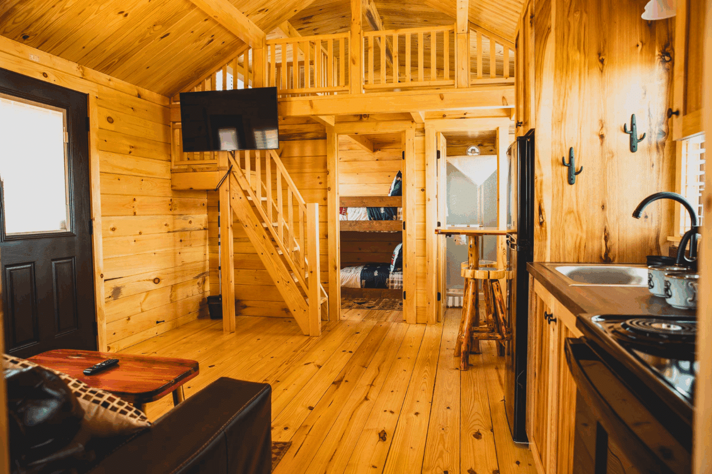 Second bedroom bathroom and lofted sleeping area of Pinecrest park model tiny home
