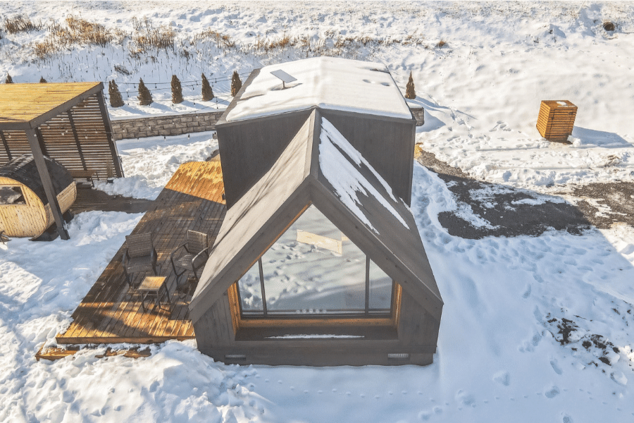 gray 2 bedroom A frame ADU in the snow in Minnesota