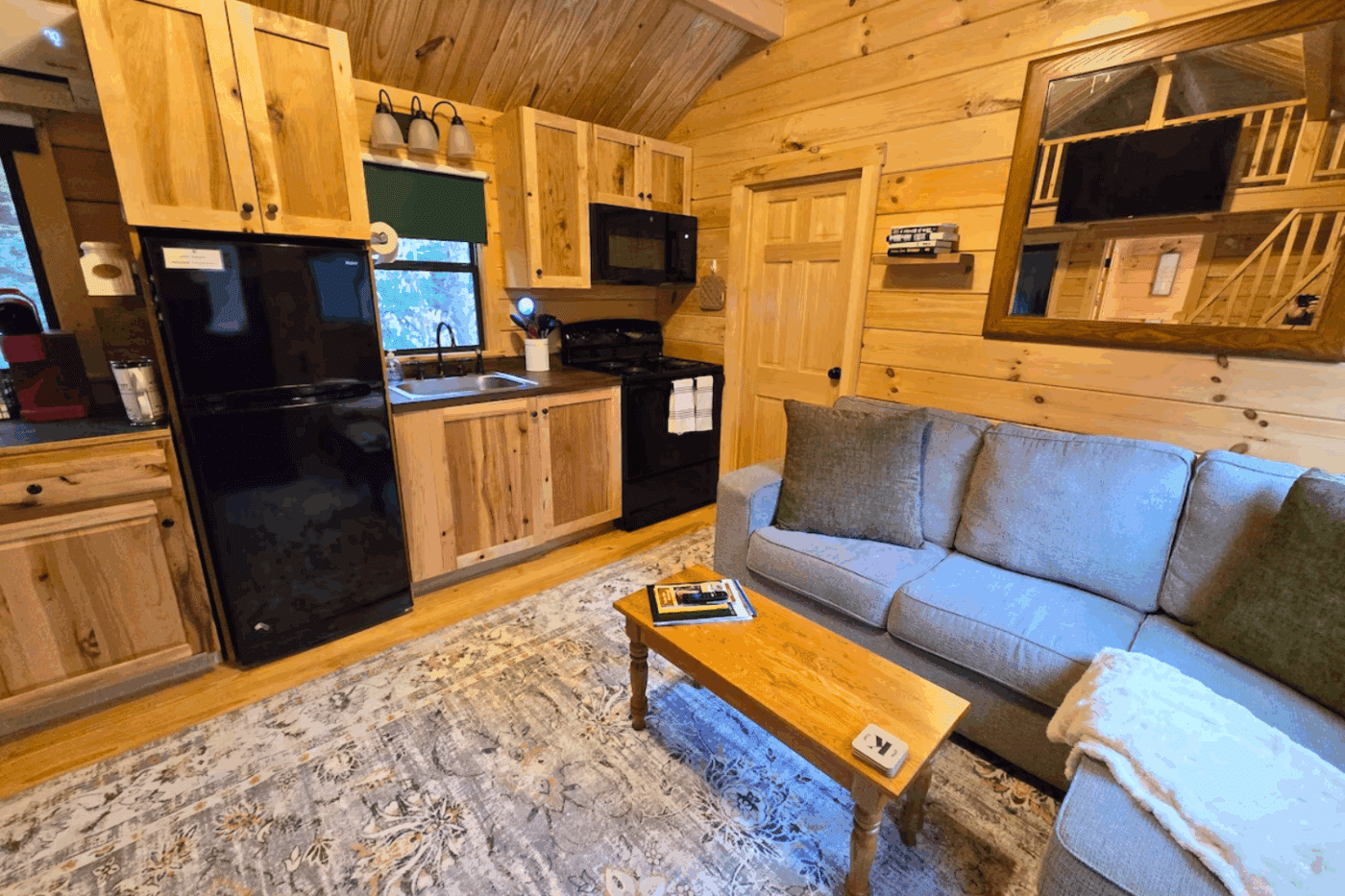 living room and kitchen in Pinecrest park model tiny home built and designed by Psy Homes tiny home located in Bath NH