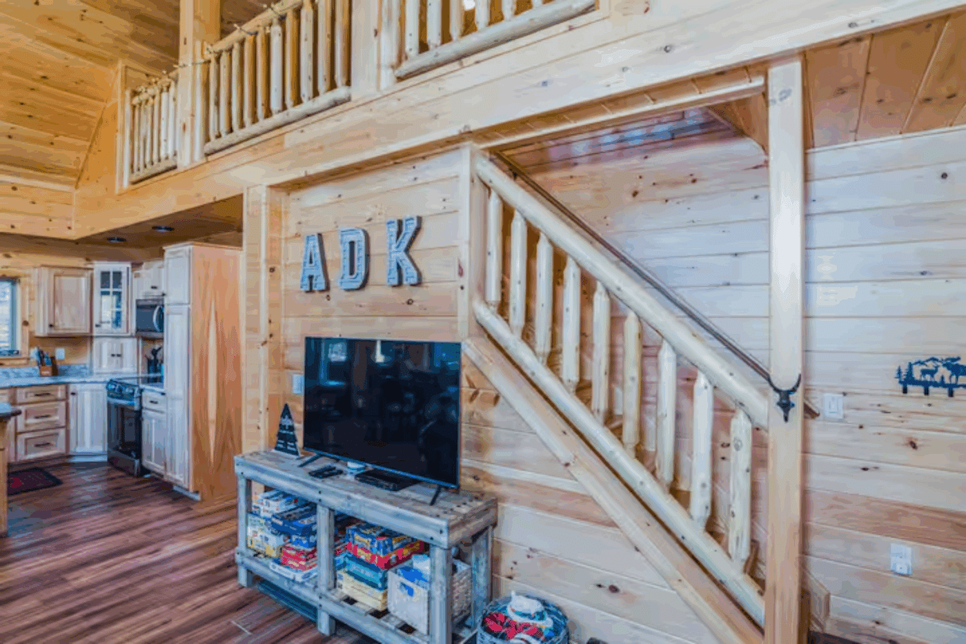 Stairway to loft area of mountaineer deluxe in old forge new york built by log cabin builder Psy Homes