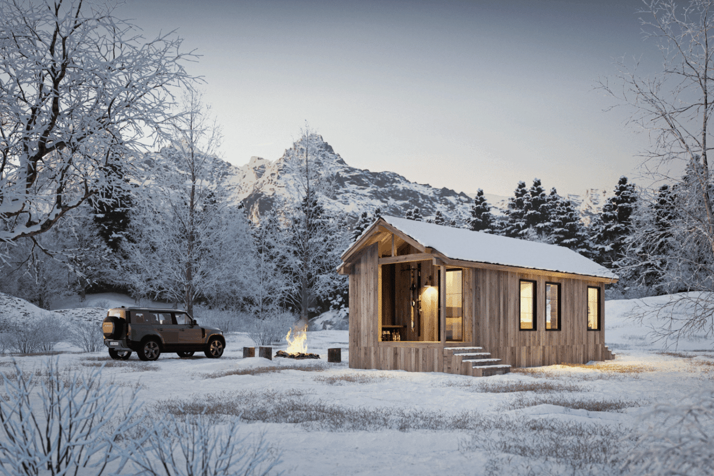 Compact wood park model tiny home set in a snowy forest with mountains and a campfire nearby.