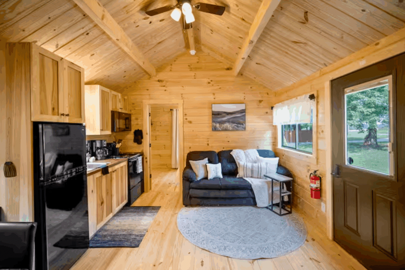 Living room and kitchen in Pinecrest park model tiny home in Strasburg Pa built and designed by Psy Homes