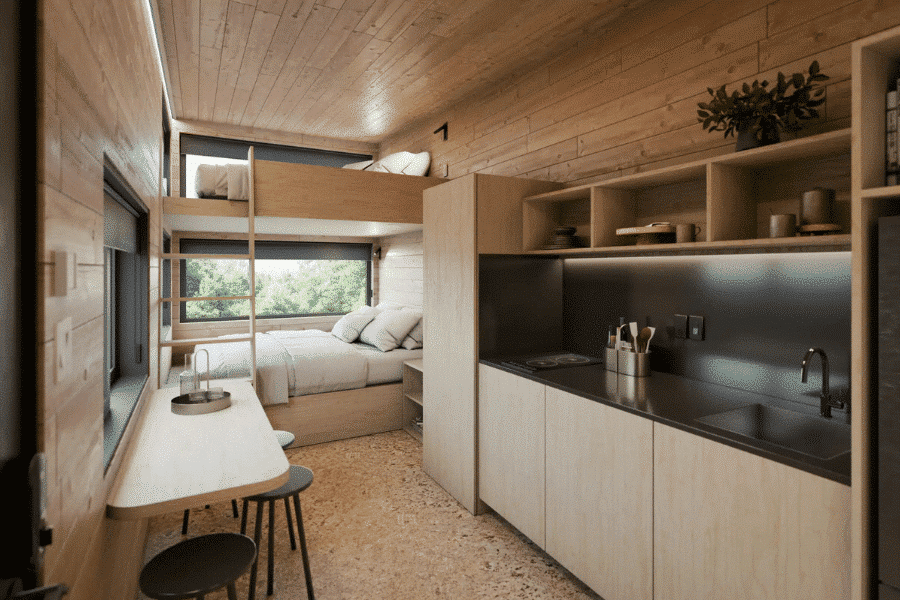 interior of nook park model tiny home with kitchen loft beds and ample storage space