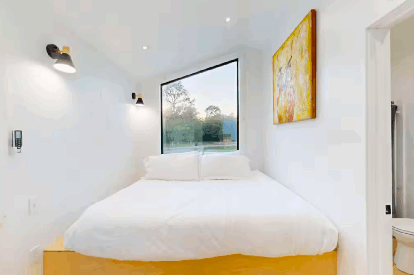 bedroom of A frame park model tiny home in Broken Bow Oklahoma