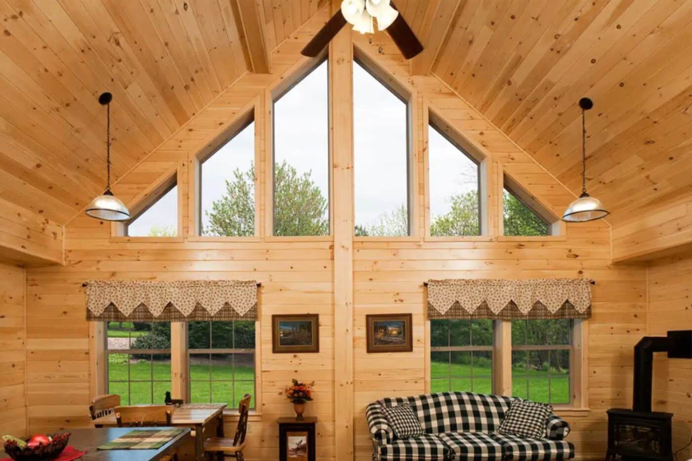 Inside of log cabin with view of windows and outside