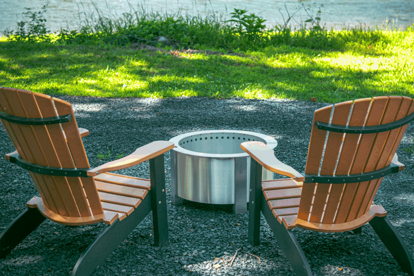 Outdoor hospitality area of log studio park model site 4 at The Outpost Resort in pond eddy New york