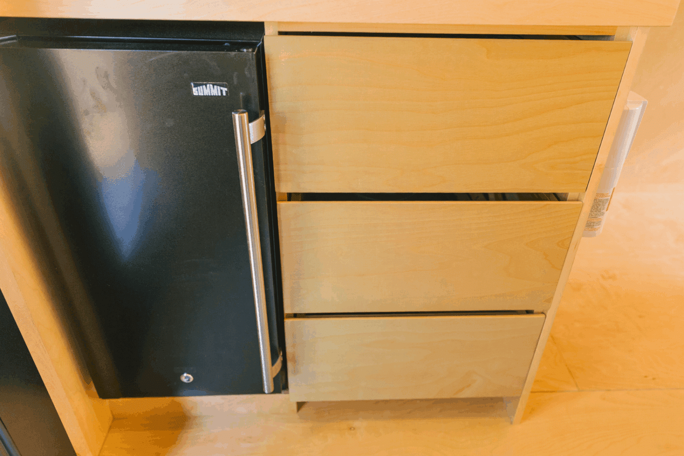 fridge and storage area of Psy Homes Vista glamping pod at Somerset resort in friedens pa