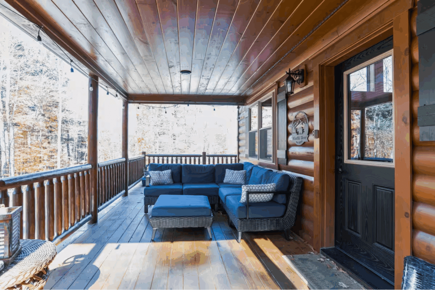 covered front porch of Mountaineer Deluxe modular log cabin in Old Forge New York built and designed with Psy Homes