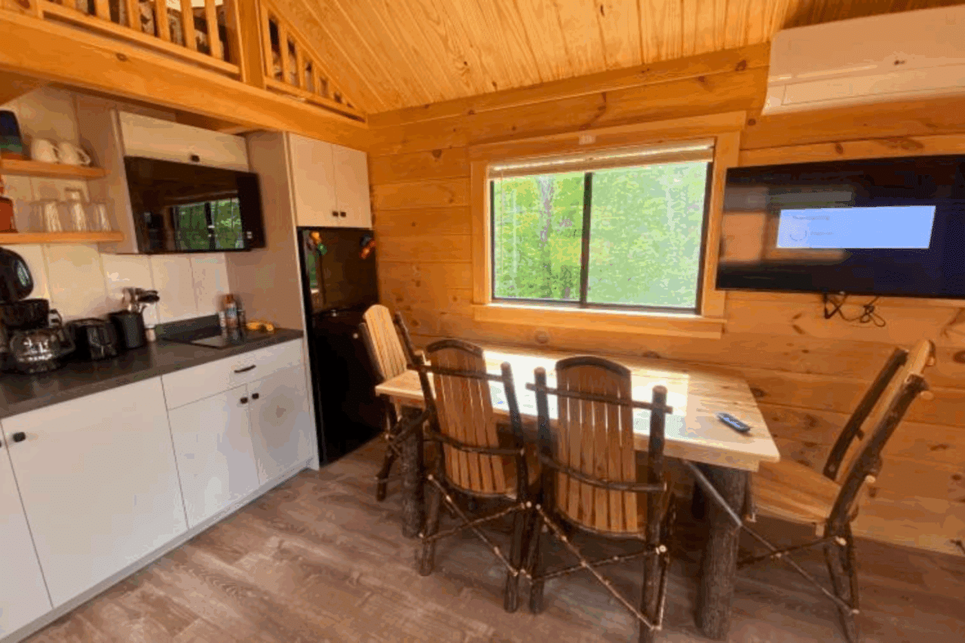kitchen and dining area of Aspen 1 park model log tiny home in 49931
