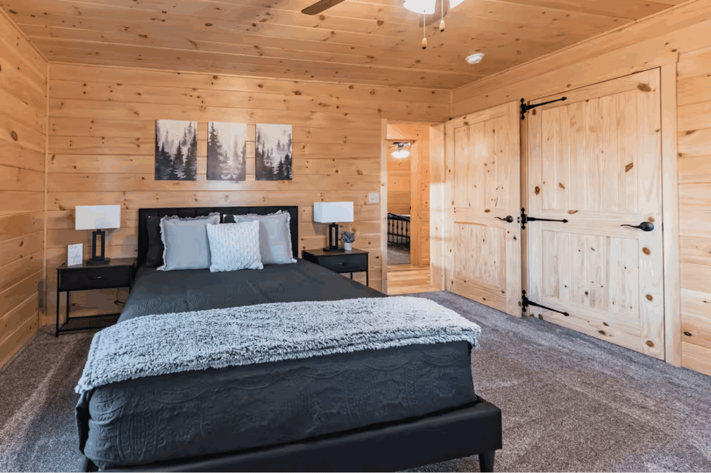 main bedroom of Vermontville New York Mountaineer Deluxe log cabin from Psy Homes