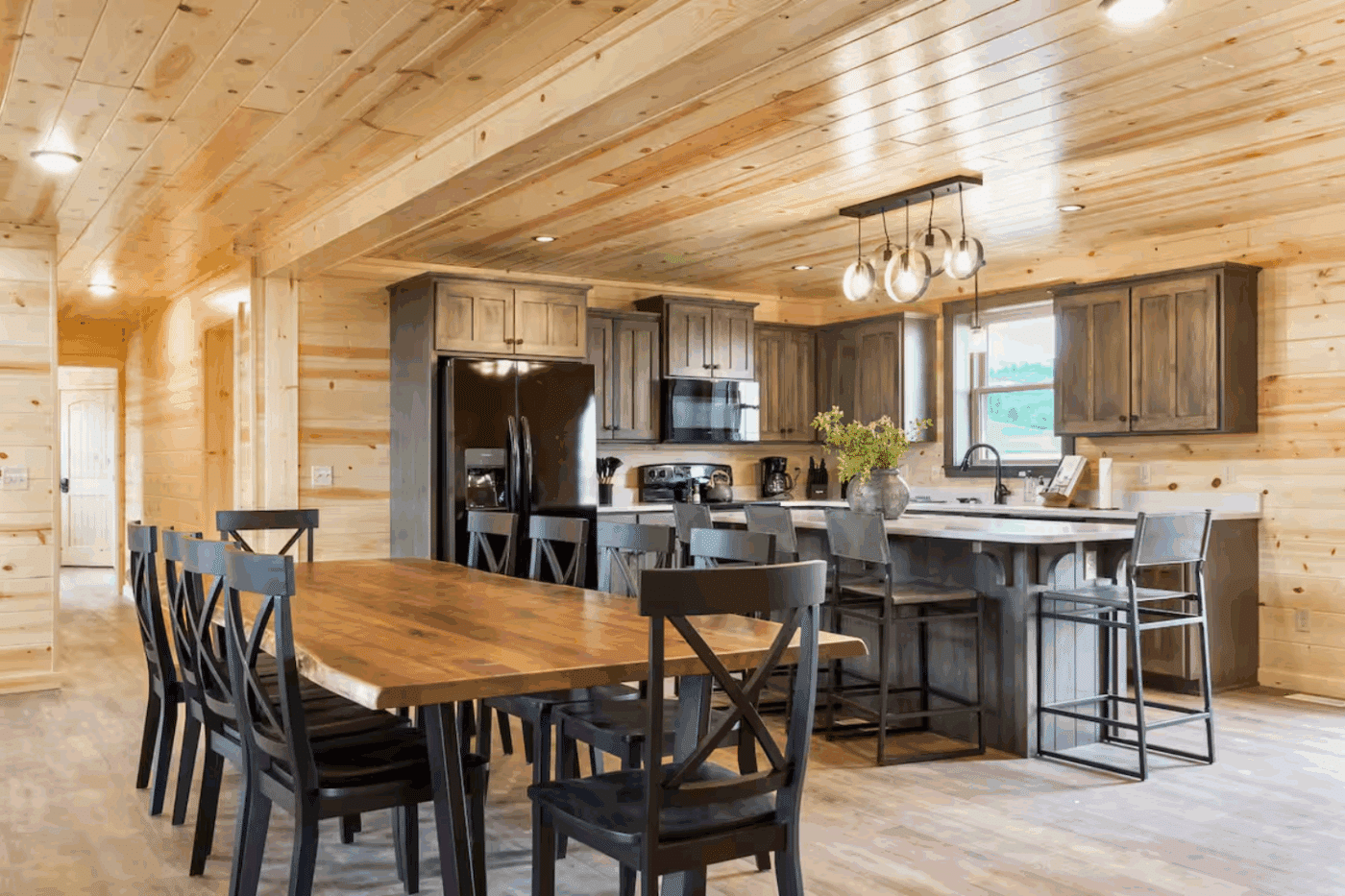 dinning room and kitchen with large island in Driggs ID Canyon Lodge modular log cabin