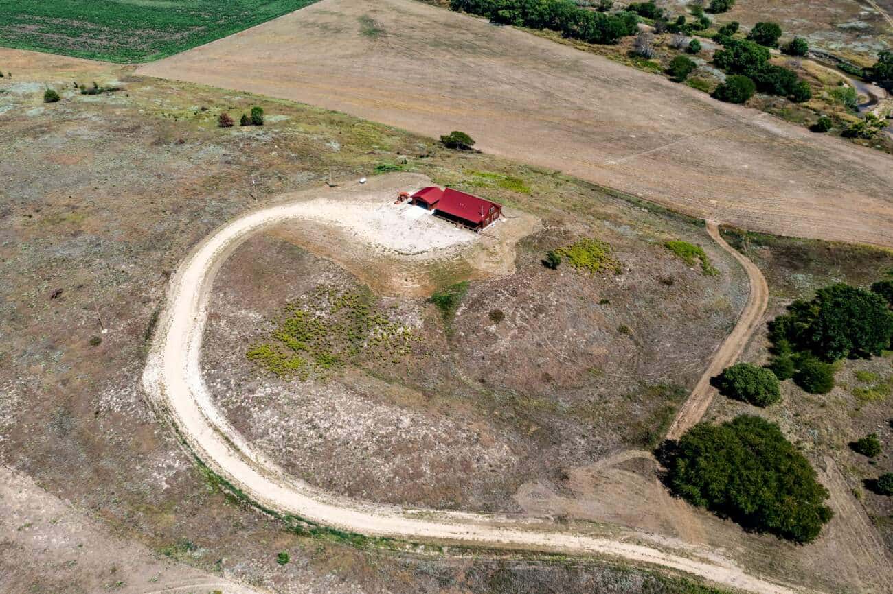 Log home with red roof in Russell KS