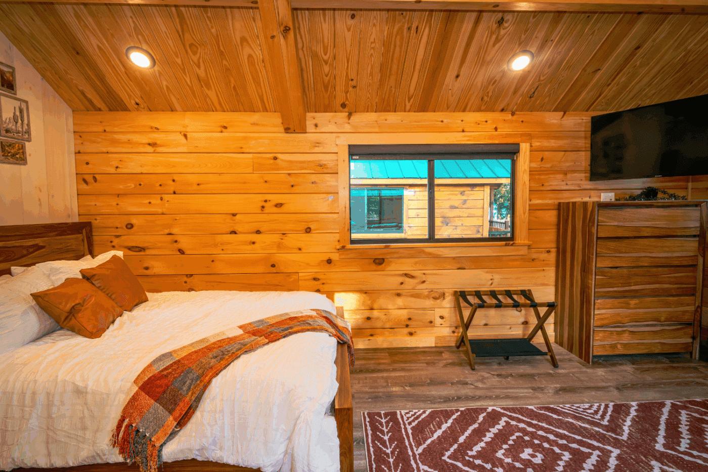 sleeping area of log studio park model tiny home built and designed by Psy Homes cabin 3