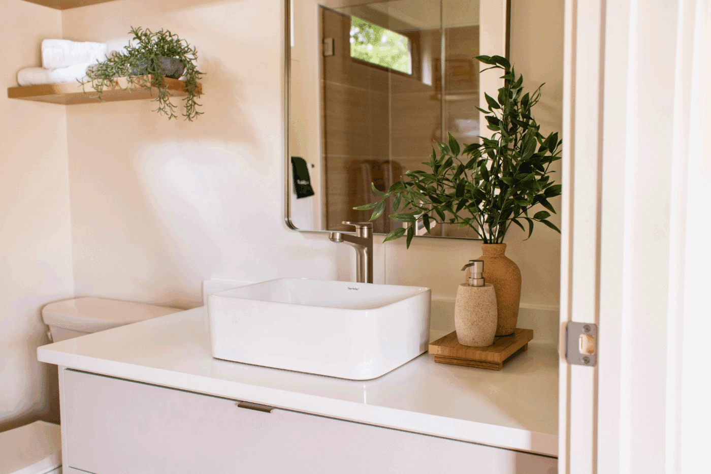 vanity and and toilet of Sonoma park model tiny home at Rd Run Resort site 102 built and designed by Psy Homes