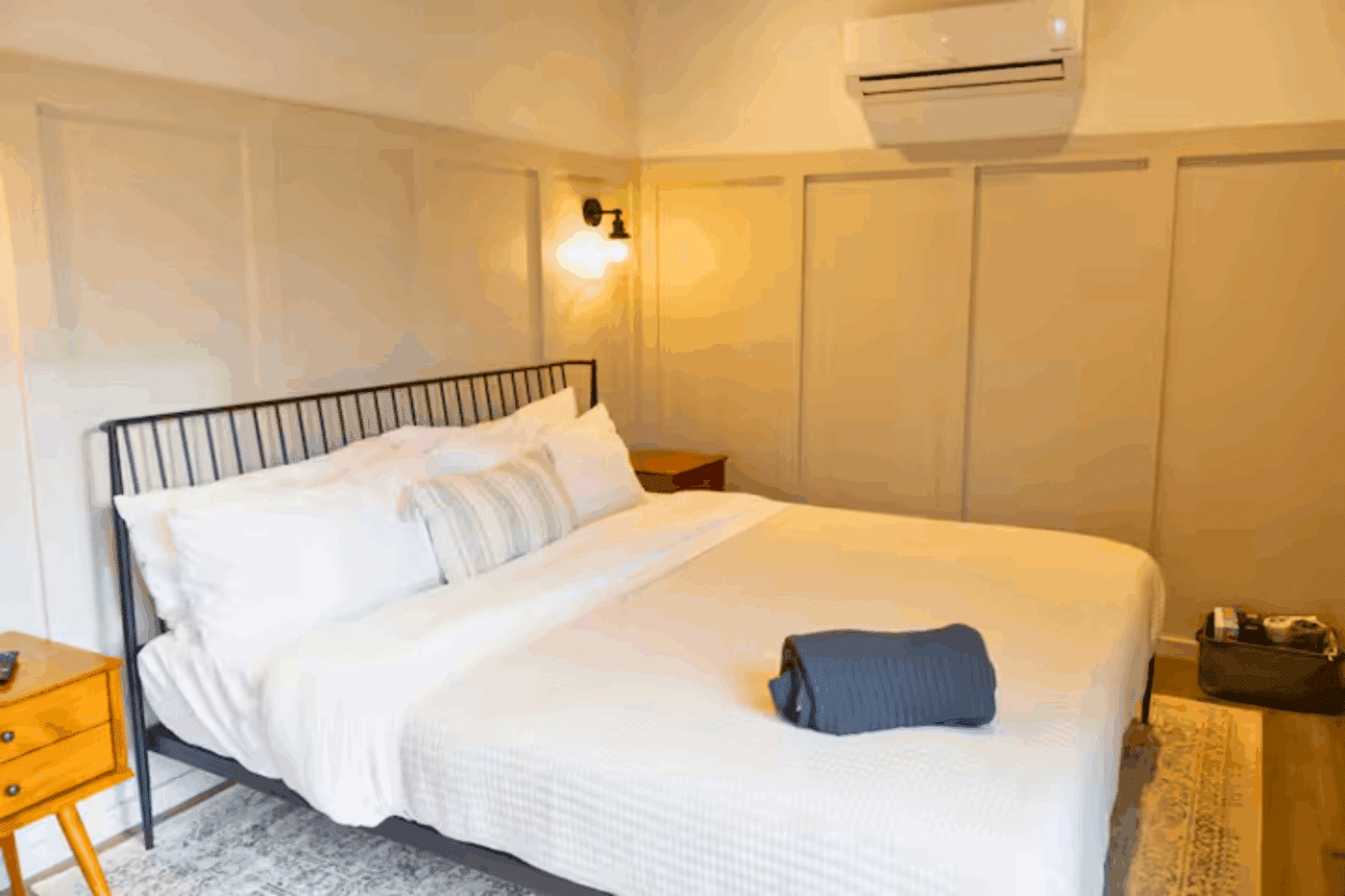 king bed sleeping area of custom built Alpine park model 3 tiny home in Madison VA