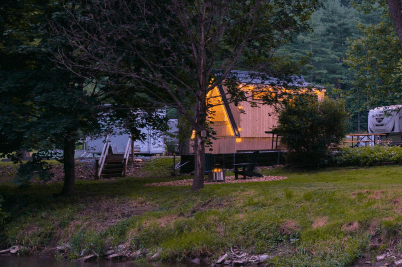 creek front custom built A frame glamping pod built and designed by Psy Homes