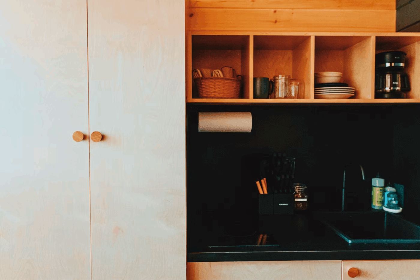 Kitchen and storage area of Nook Studio Peak Park Model tiny home in Northern Michigan at Retreat North Cabin 3